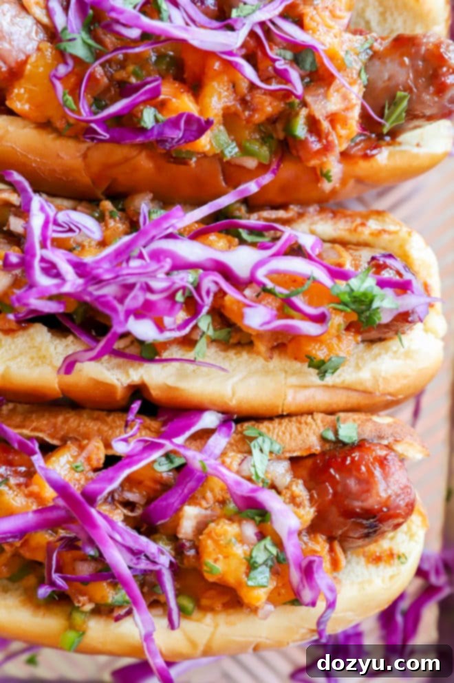 A sheet pan filled with perfectly grilled bratwurst sausages alongside a vibrant peach salsa.