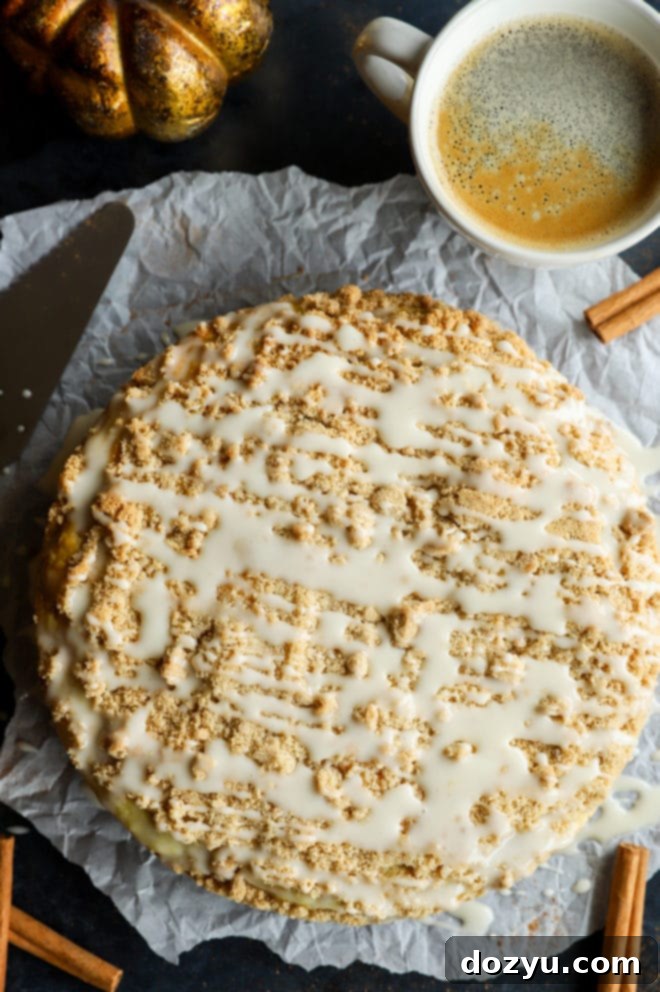 Pumpkin cake image overhead with coffee and fall decor