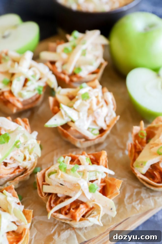 A beautifully presented Spicy BBQ Chicken Wonton Cup, with a focus on the crispy texture and fresh coleslaw topping.
