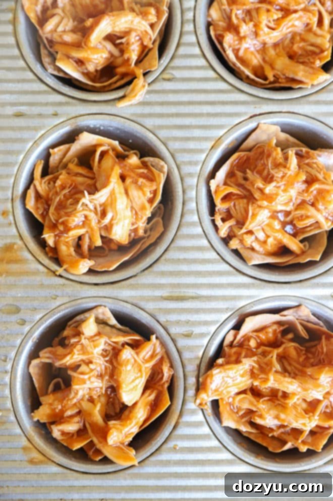 Ingredients laid out for making Spicy BBQ Chicken Wonton Cups, including Head Country BBQ sauce, wonton wrappers, and fresh produce.