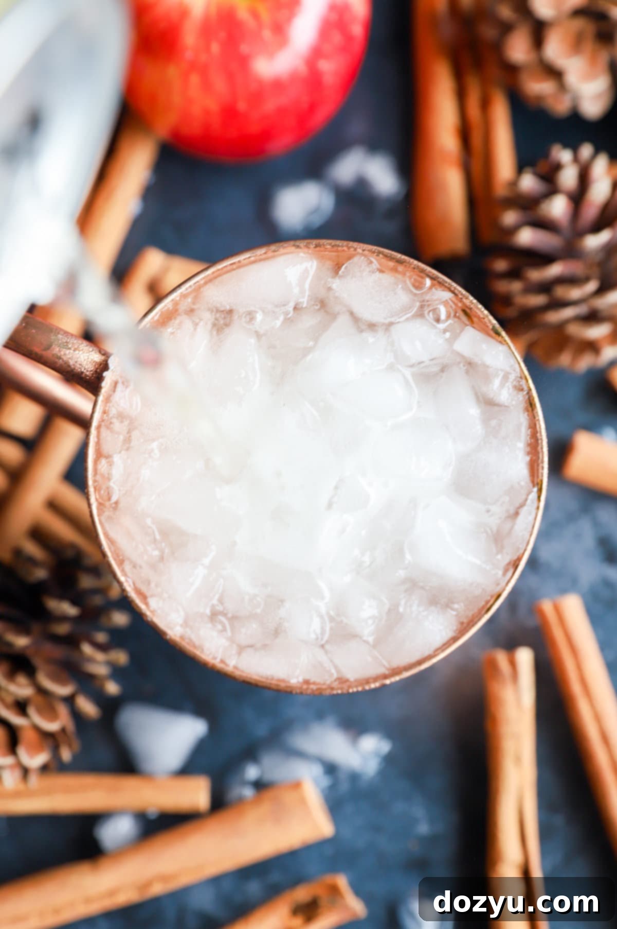 Autumn Spiced Apple Cider Moscow Mule 4 Adding ginger beer to a copper mug cocktail picture