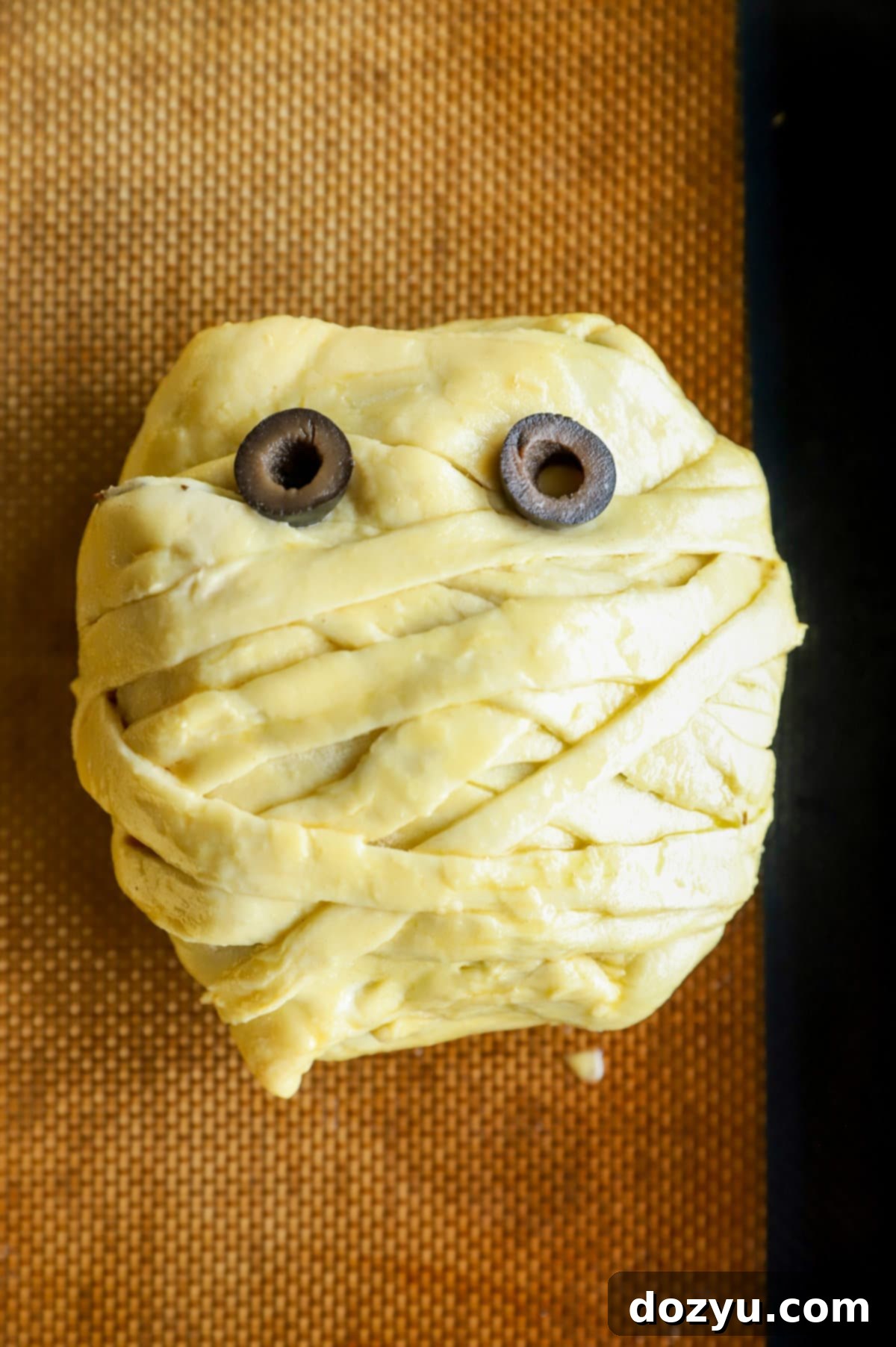 Crimson Shroud Wellington 12 Olives for eyes on a mummy steak for Halloween image