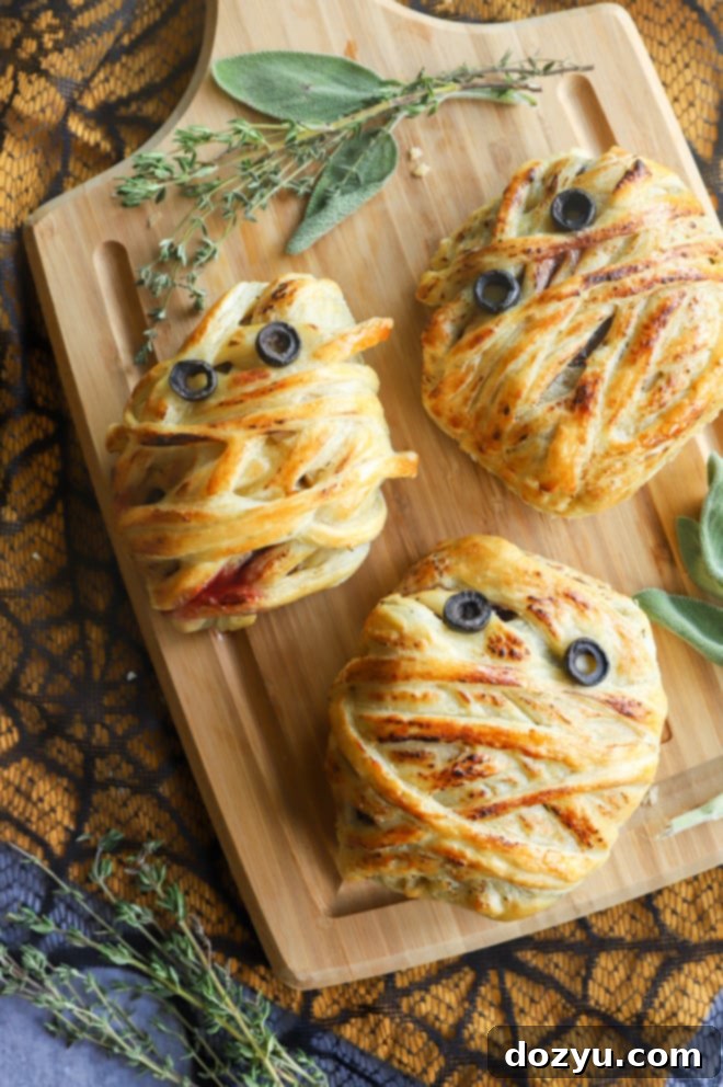 Crimson Shroud Wellington 15 Overhead view of mummy wrapped beef on cutting board