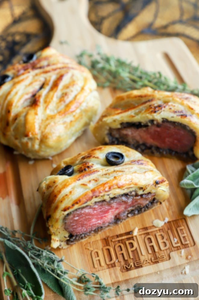 Crimson Shroud Wellington 4 Image of beef wellington cut into on cutting board