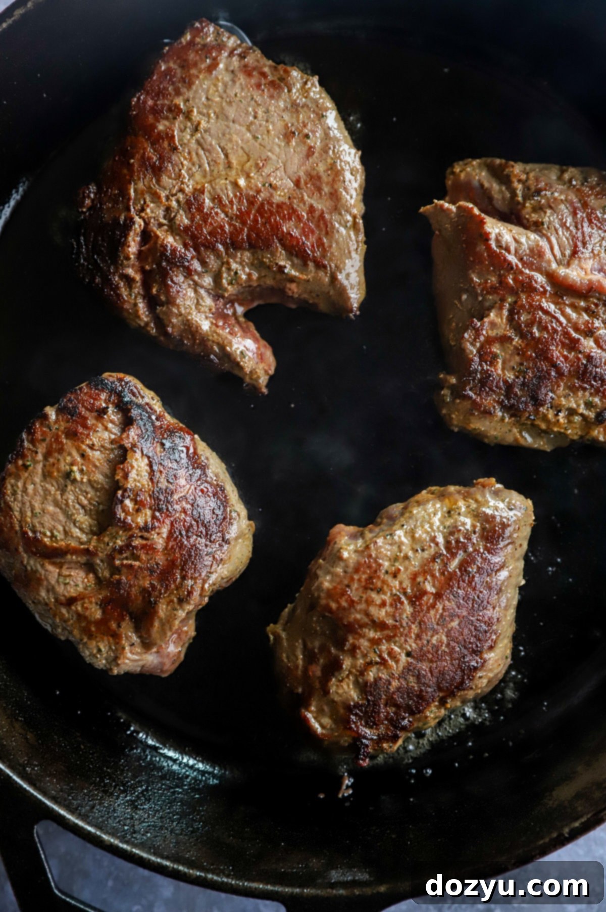 Crimson Shroud Wellington 9 Seared sirloin steaks in cast iron skillet image