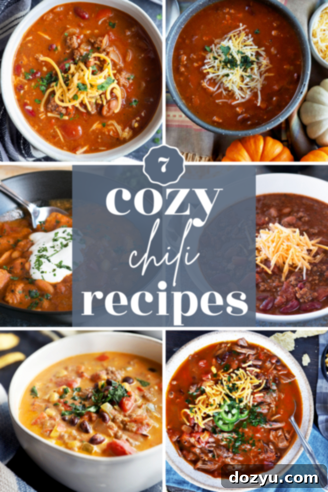 A steaming bowl of classic beef chili, generously topped with shredded cheese and a dollop of sour cream, perfect for a cozy meal.