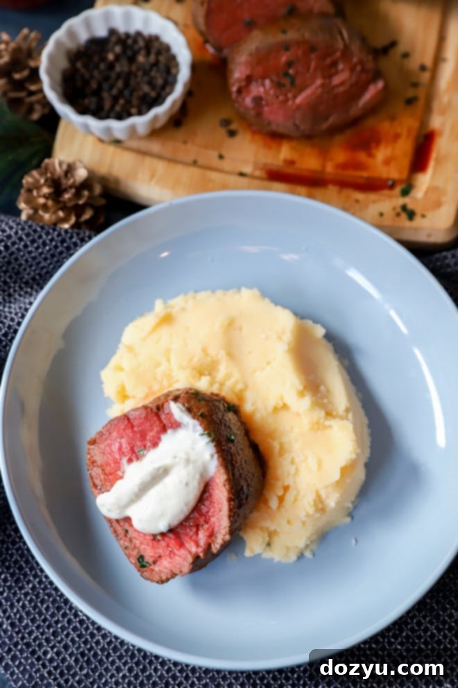 plate of mashed potatoes and steak with horseradish
