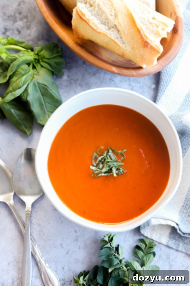 Easy Instant Pot Tomato Soup 10 Photo of winter comfort food in bowl with basil and bread