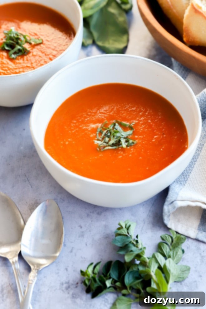 Easy Instant Pot Tomato Soup 3 Side photo of bowls of soup with spoons and bread