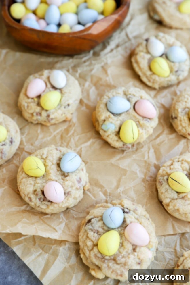 A beautifully arranged image of Easter Mini Eggs Cookies on a baking sheet, ready to be enjoyed.
