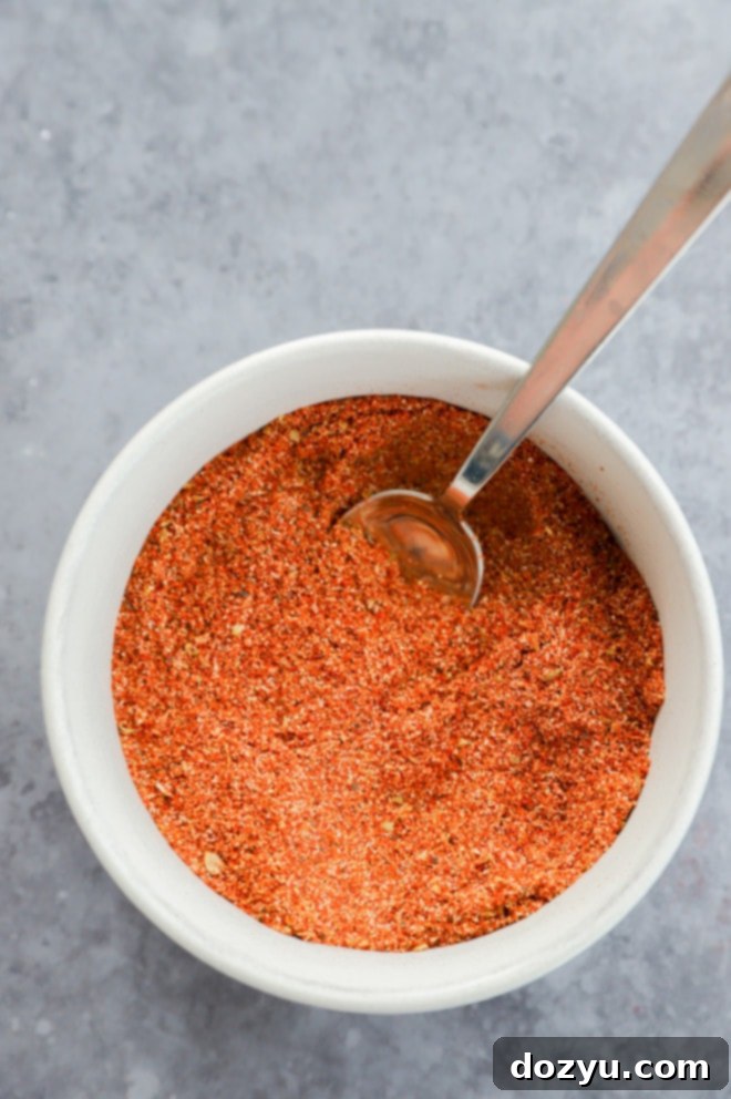 The Ultimate Chicken Taco Spice Mix 5 Picture of a small bowl with a spoon in chicken taco seasoning mix