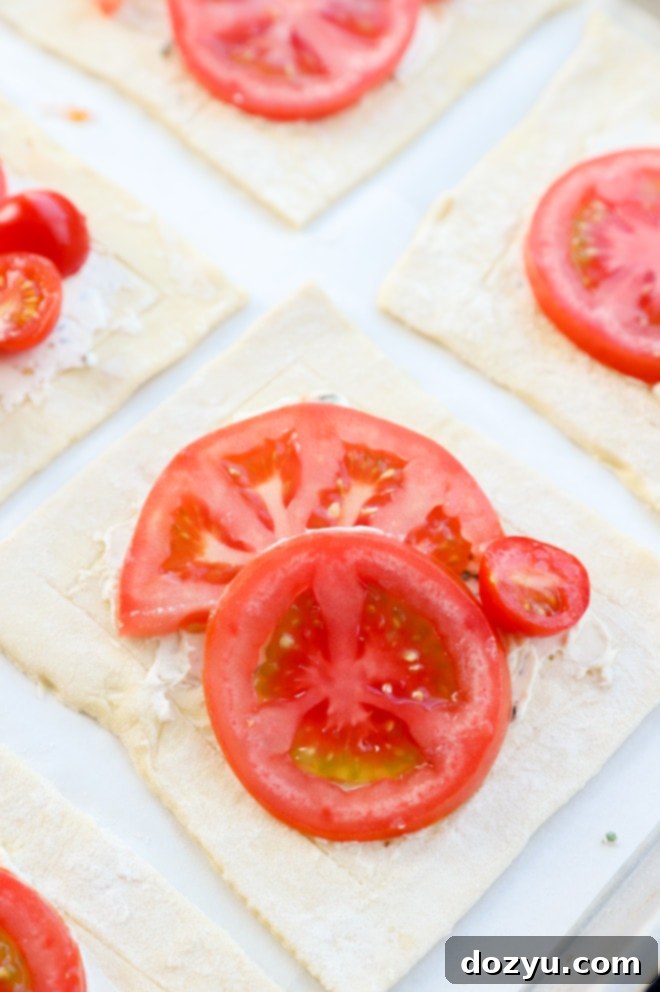 Tomato tart with fresh slices of tomatoes and cream cheese mixture image