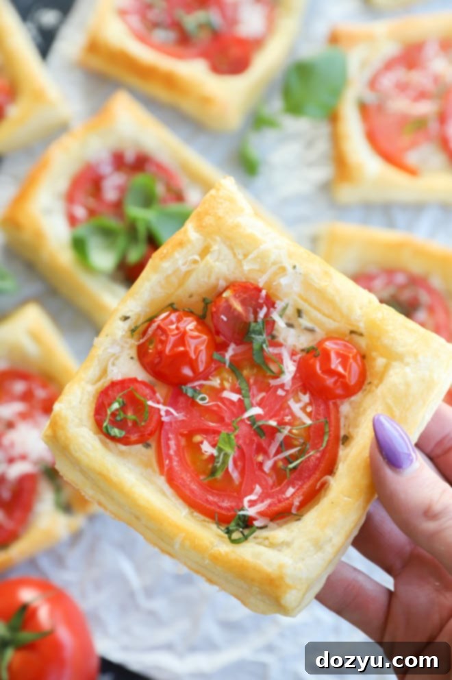 Hand holding tart made with puff pastry and fruit image