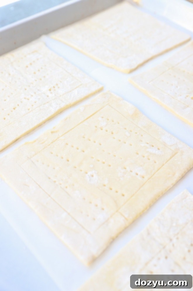 Pieces of puff pastry on a baking sheet image