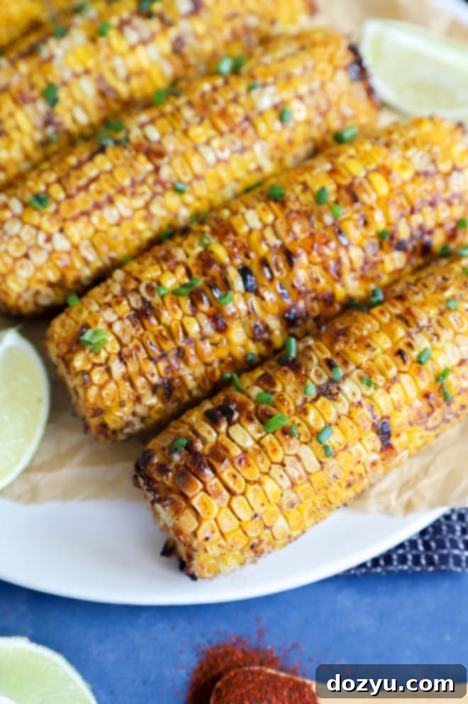 Picture of blackened corn on a platter with lime