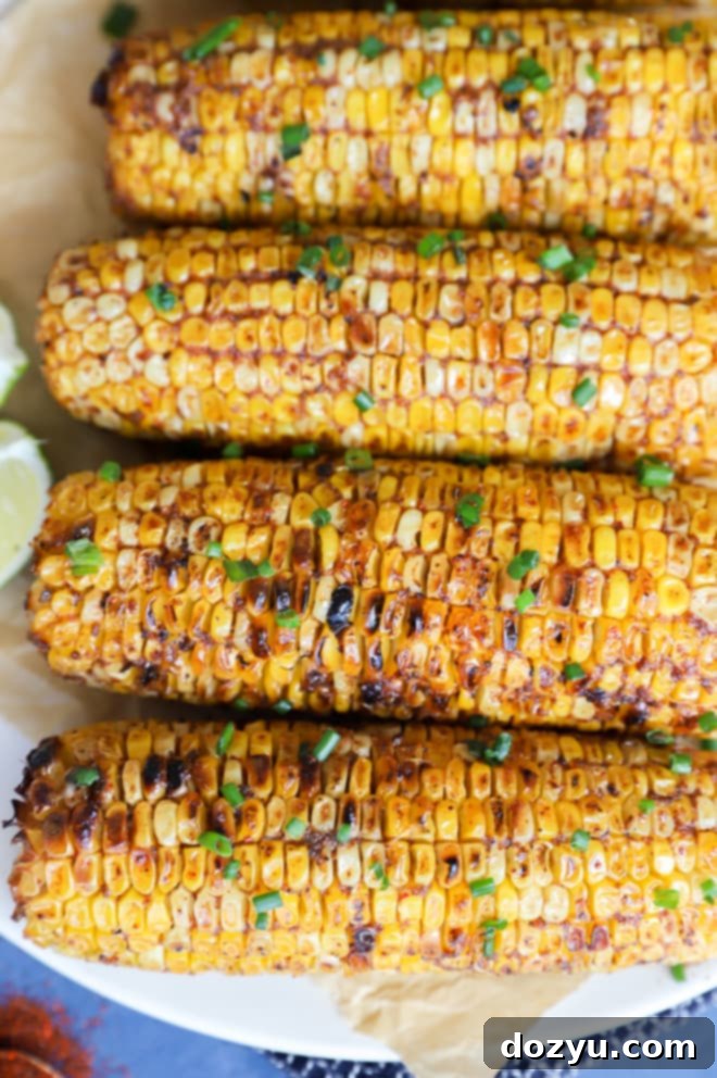 Image of grilled vegetables on a platter with lime wedges