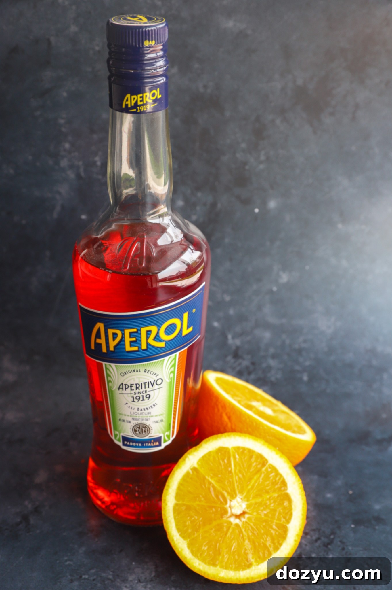 Fresh ingredients for an Aperol Sour cocktail