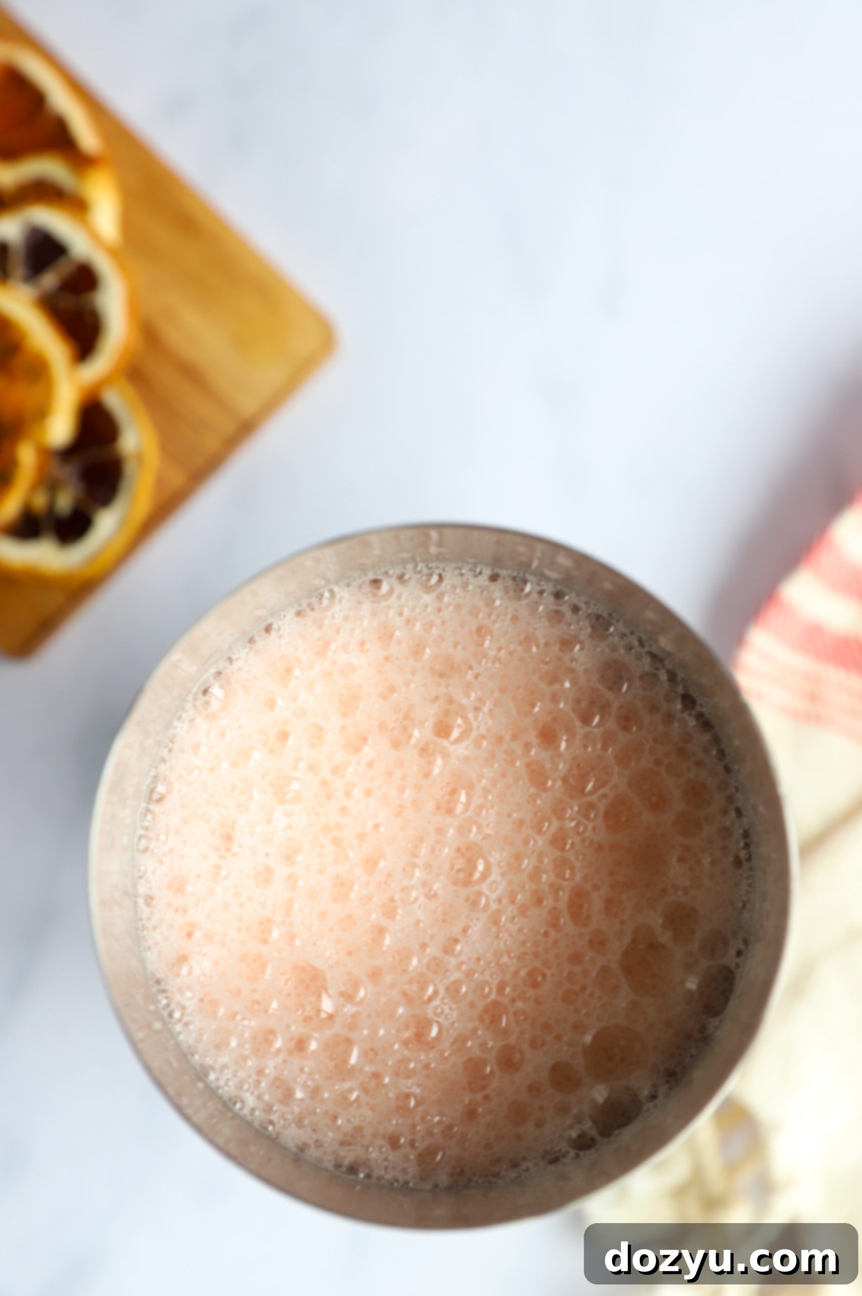 Aperol sour cocktail being shaken in a metal shaker
