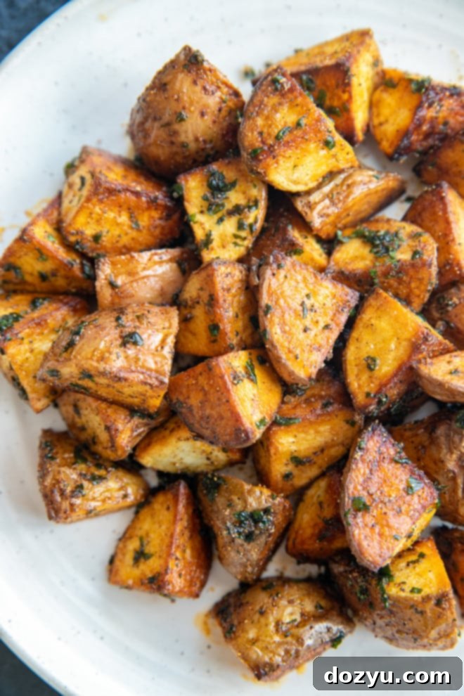 Freshly fried potatoes on a plate image
