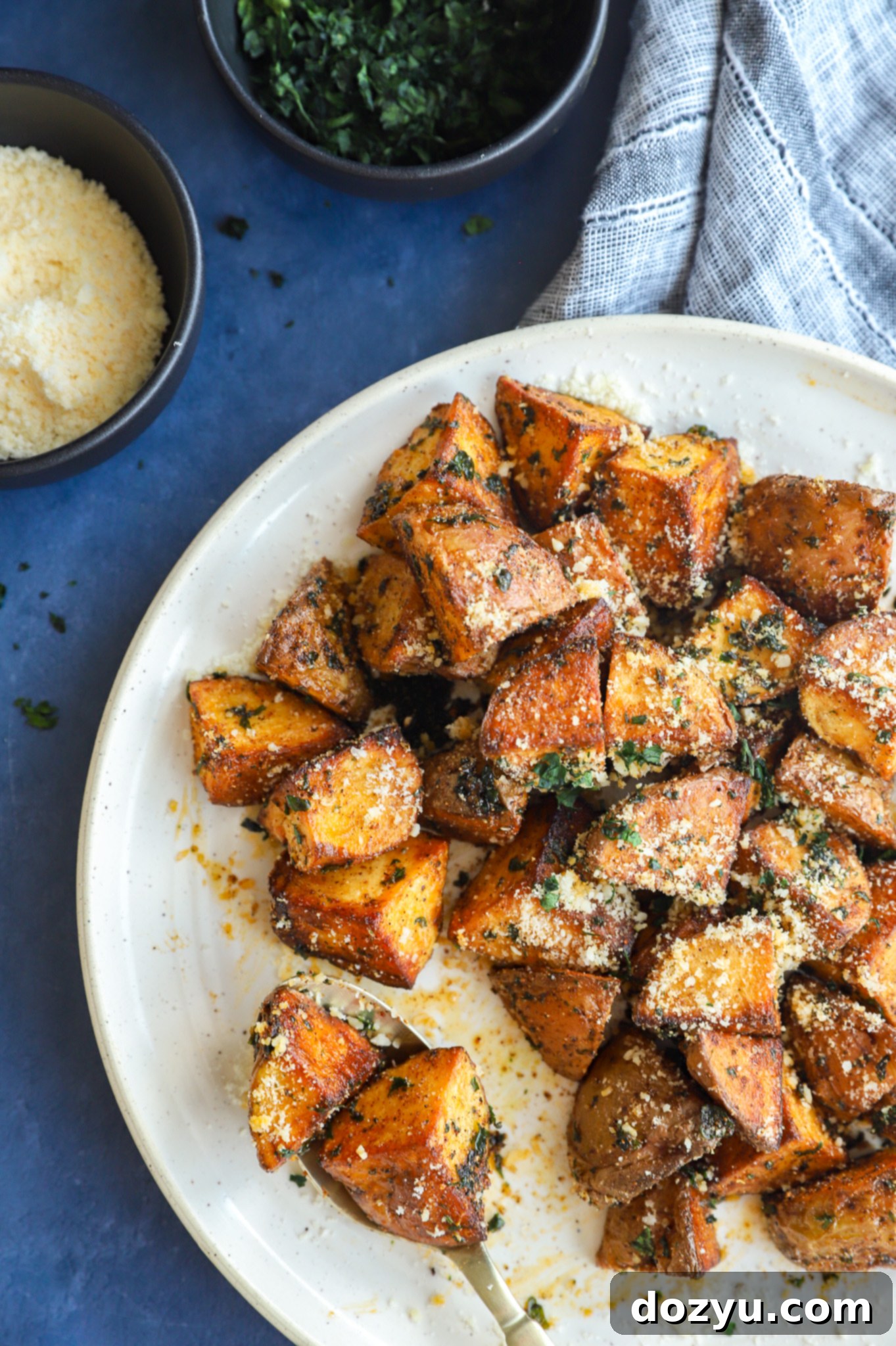 Image of potatoes on a plate with spoon