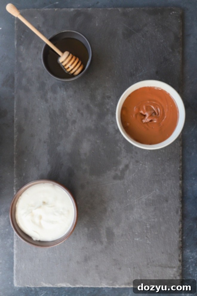 adding bowls to a platter with sweet dips image