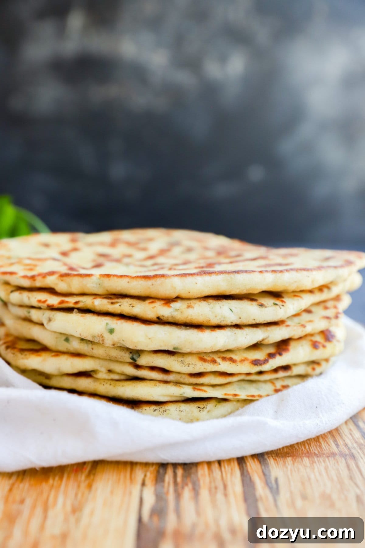 Stack of Turkish bread (Bazlama) showing off its fluffy texture.