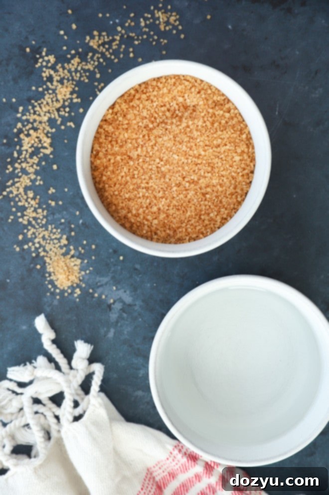 Close-up image of the two essential ingredients for demerara simple syrup: demerara sugar and water.