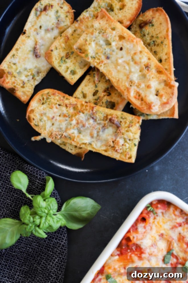 A delicious pasta dish served with crispy slices of air fryer roasted garlic bread, perfect for dipping.