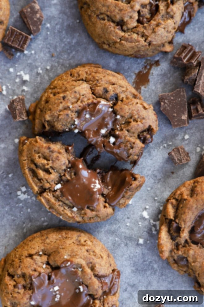 Coffee cookie pulled apart with gooey chocolate