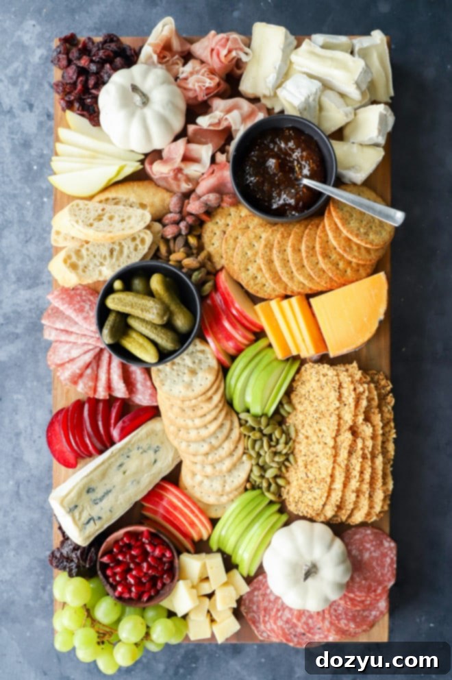 Beautifully assembled fall charcuterie board, overflowing with delicious autumn ingredients