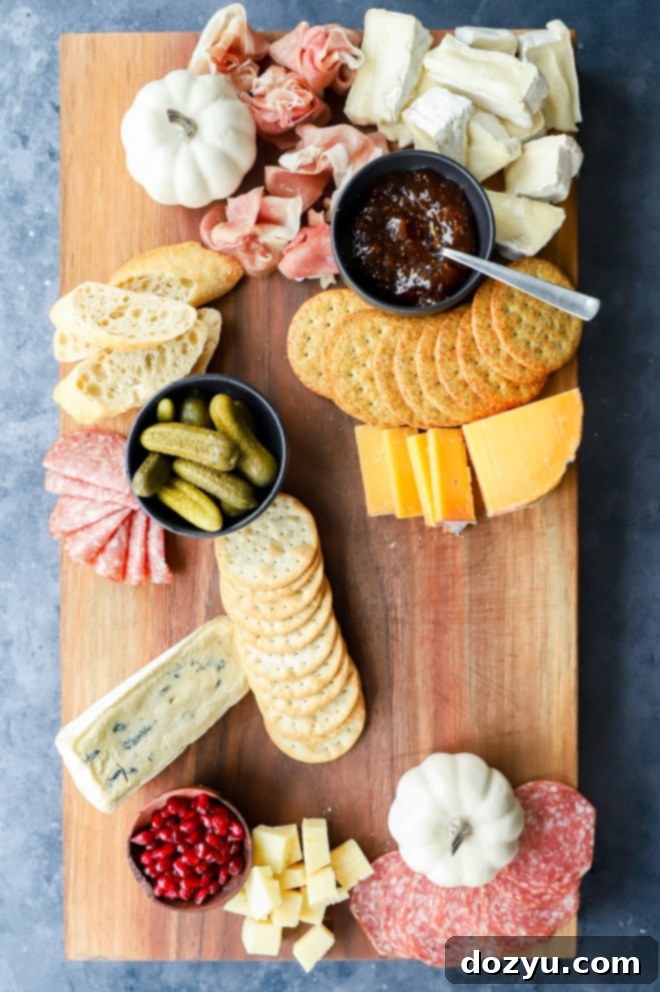 Step-by-step image of building a fall charcuterie board, showing arrangement of ingredients