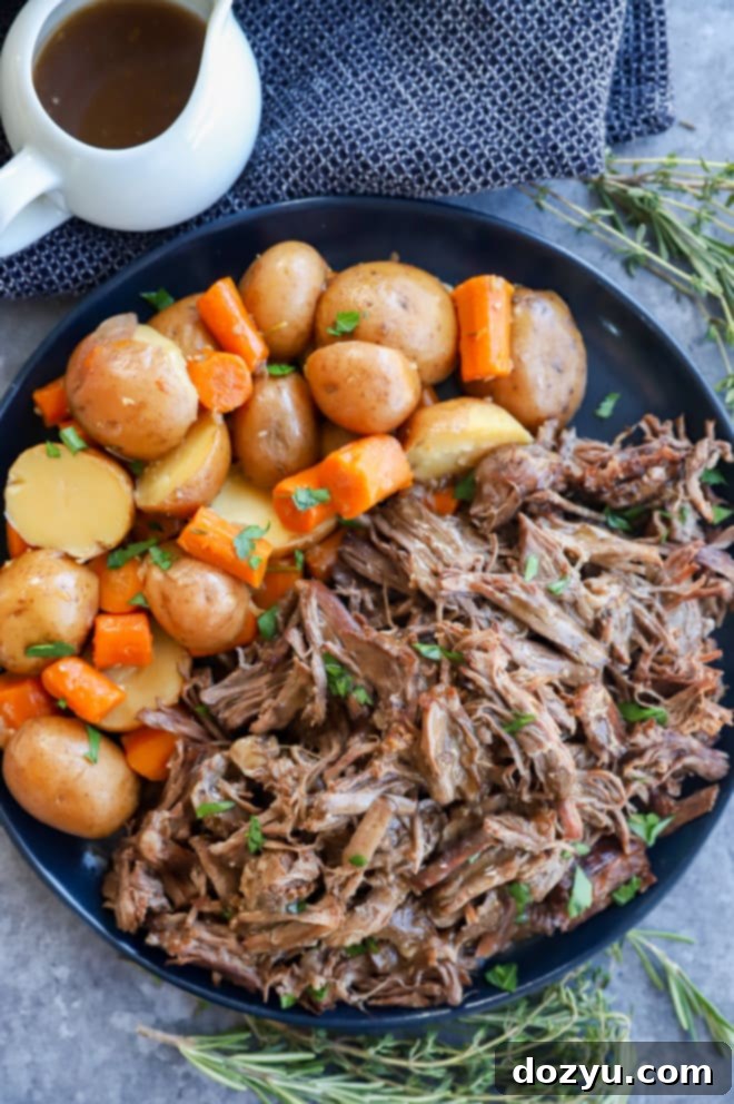 Plate of instant pot pot roast with vegetables and gravy