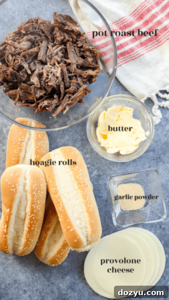 Ingredients for french dip sandwich including butter, garlic powder, buns, beef, and cheese