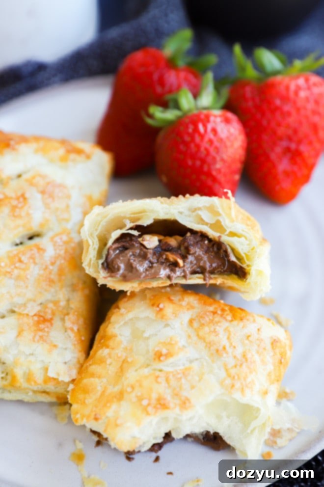 Sweet breakfast chocolate treats on a plate with fresh strawberries, ready to be enjoyed.