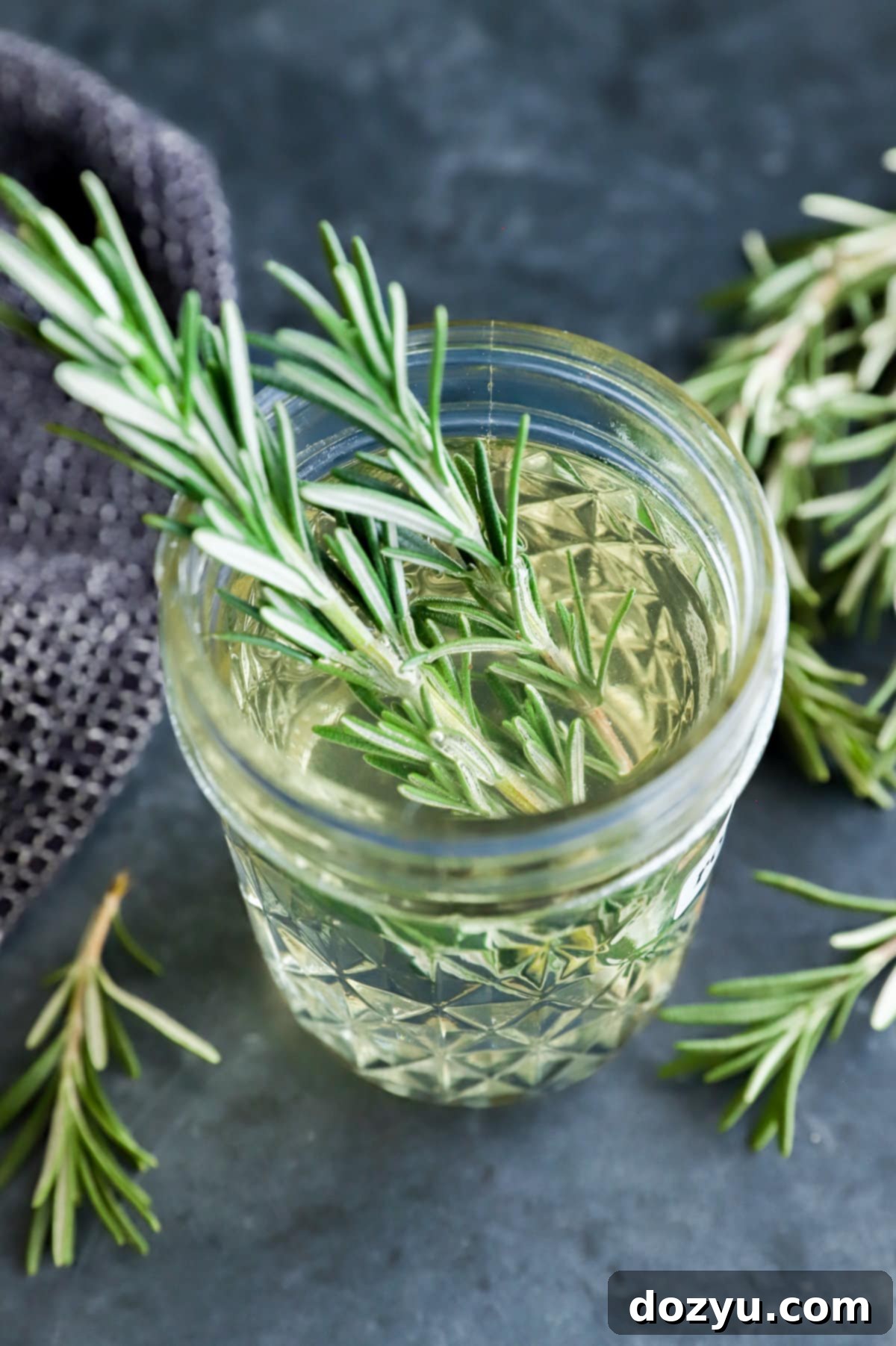 Aromatic Rosemary Nectar 9 Image of fresh rosemary sprigs in a jar of simple syrup