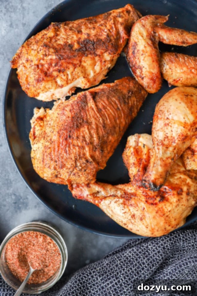 Whole smoked chicken broken down on a plate