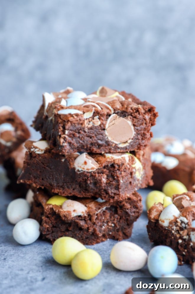 Hoppy Easter Brownies 7 easter brownies in a stack with mini eggs all around
