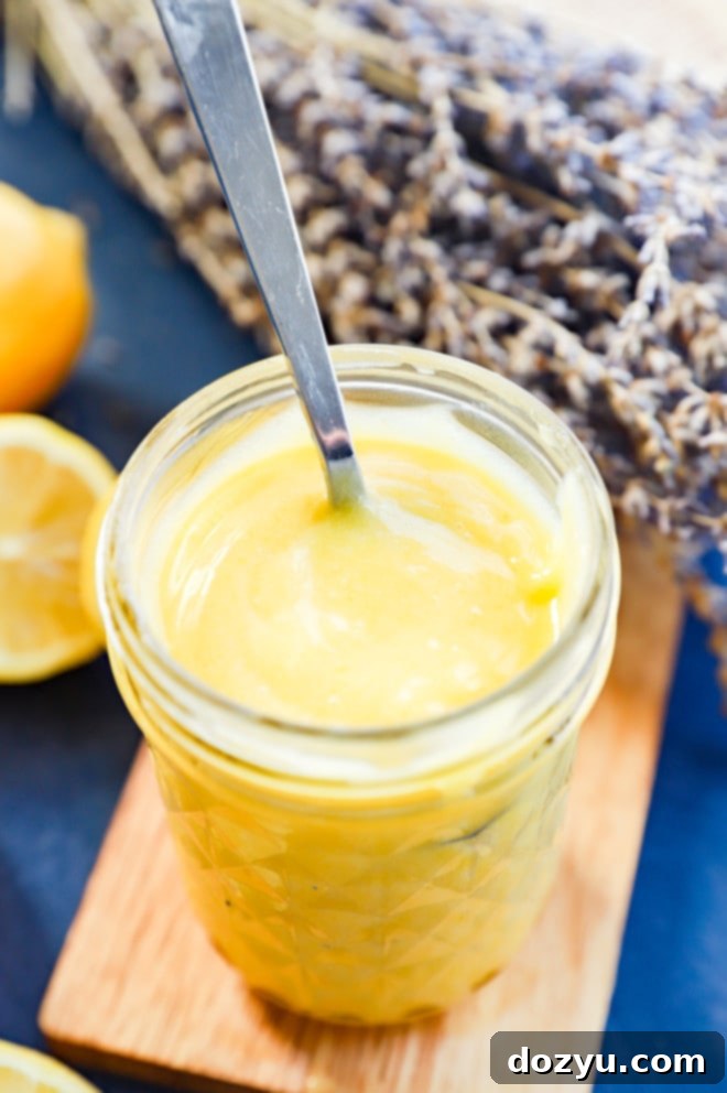 lavender lemon curd in a mason jar with a spoon