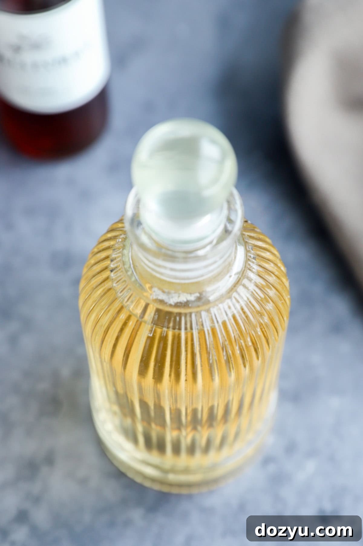 vanilla simple syrup recipe in a syrup dispenser