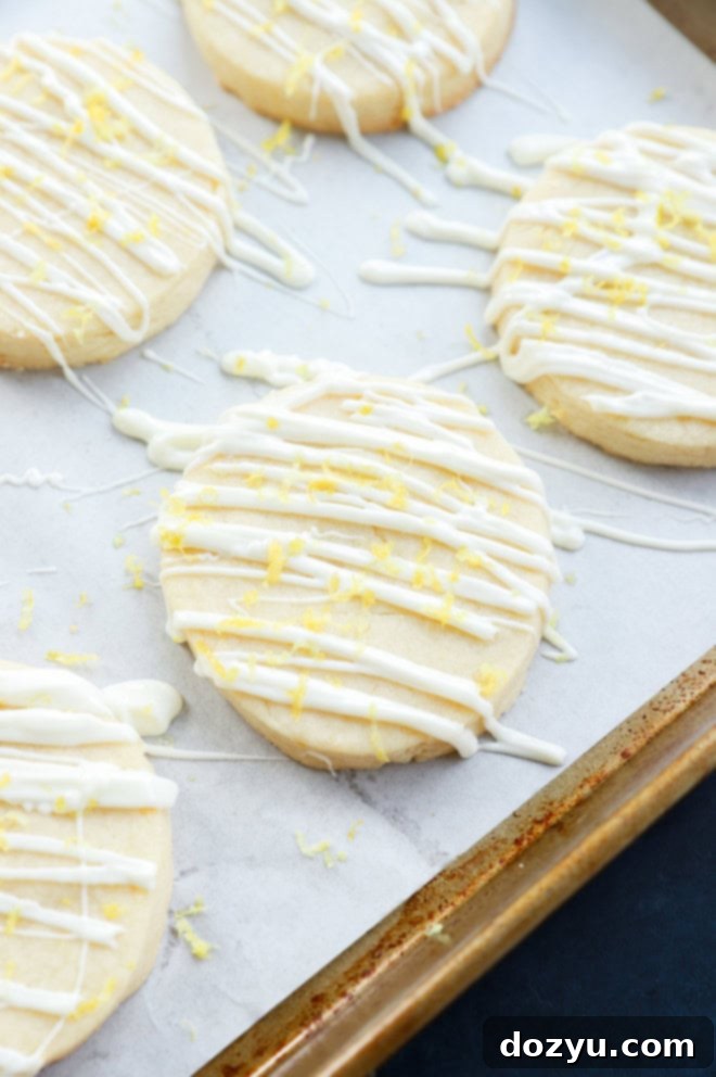 lemon shortbread cookies with white chocolate and lemon zest on top