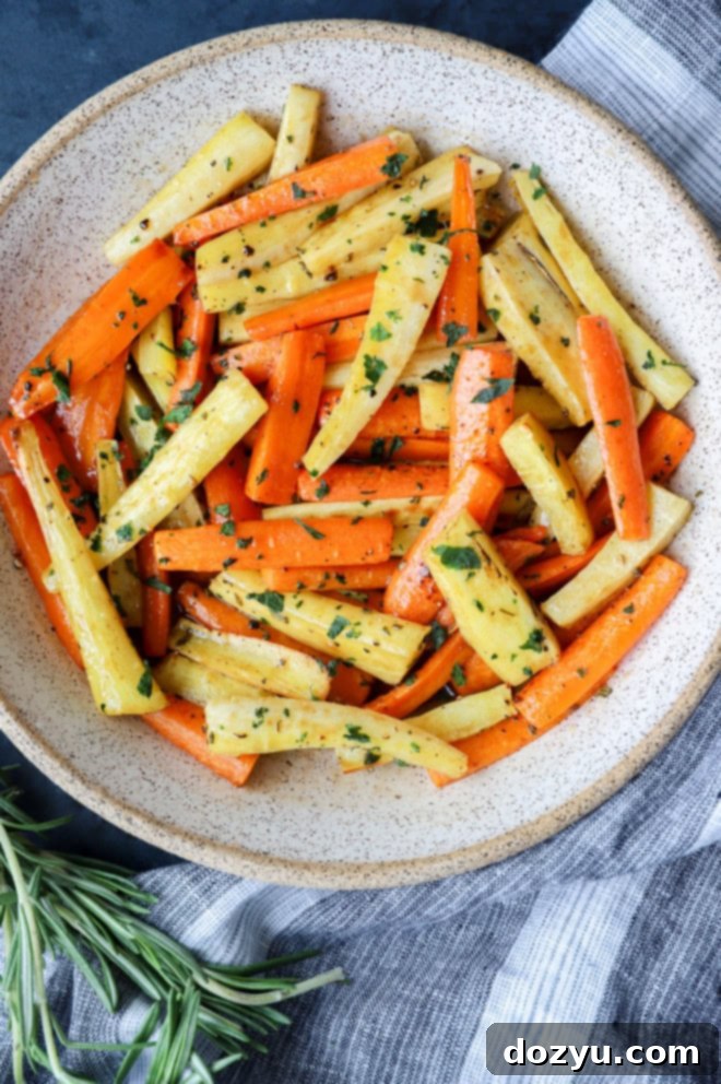 roasted vegetables in a bowl with rosemary