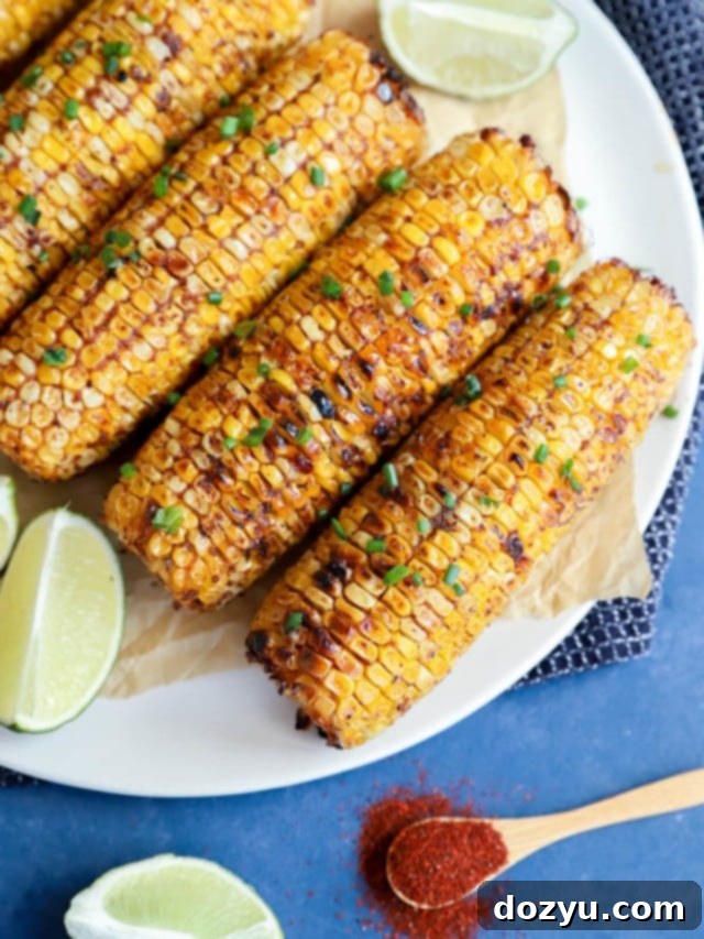 Overhead image of charred blackened corn on a plate