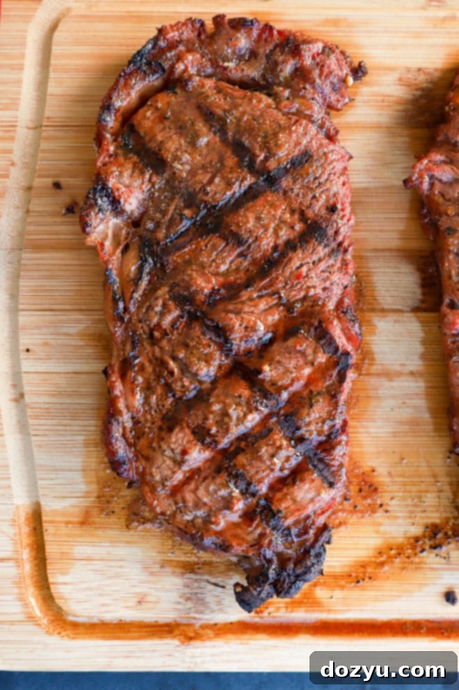 Grilled new york strip steak on a cutting board