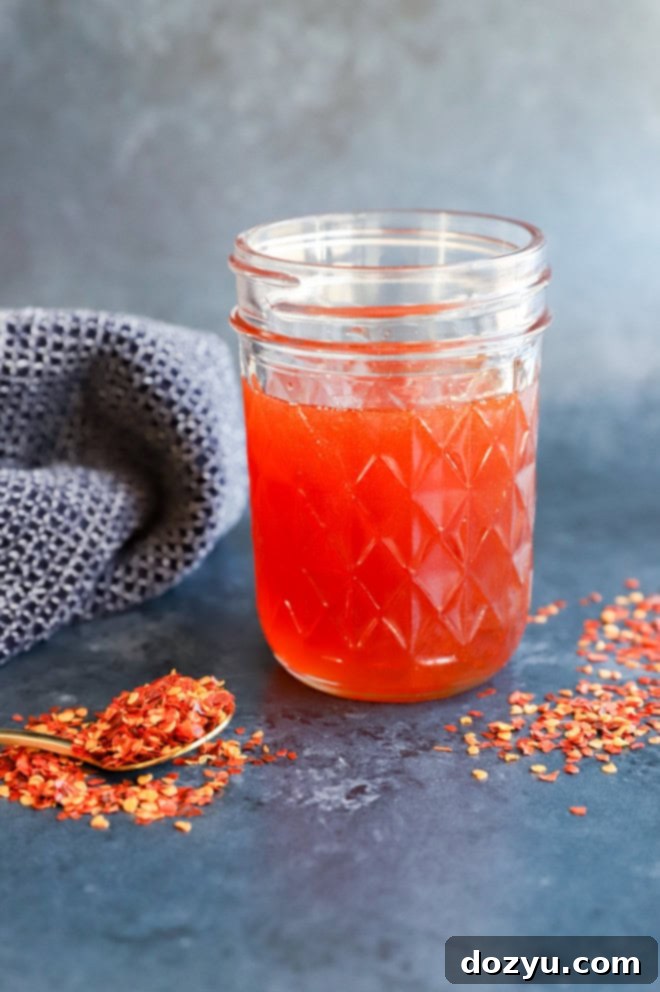 hot honey in a jar with red pepper flakes