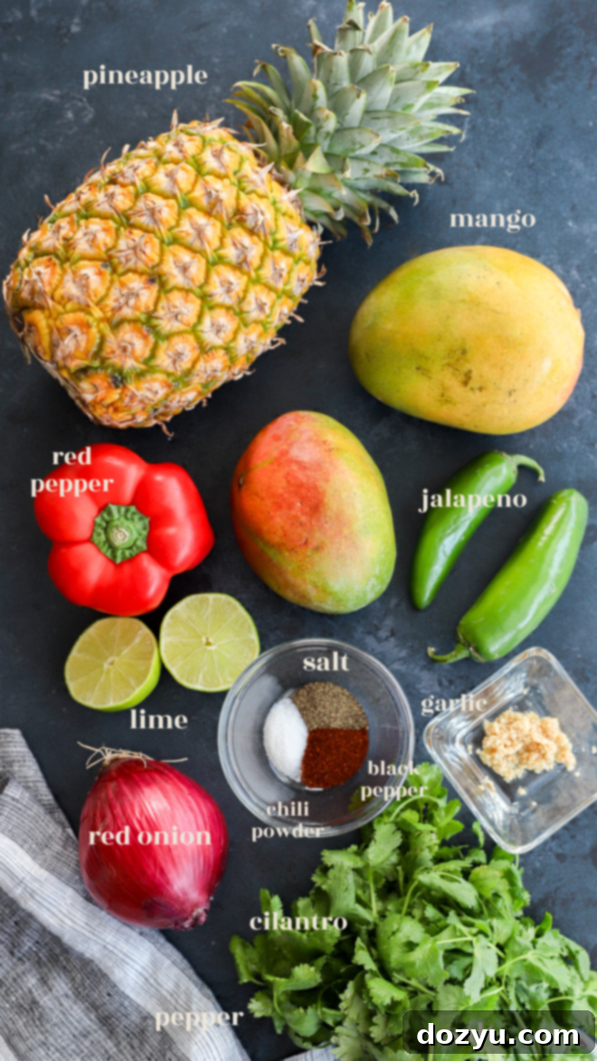 pineapple mango salsa ingredients in bowls with text label