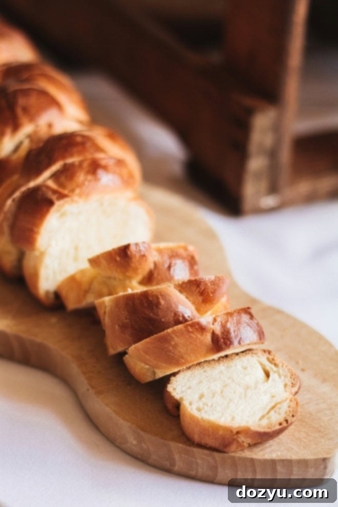 challah bread sliced on cutting board