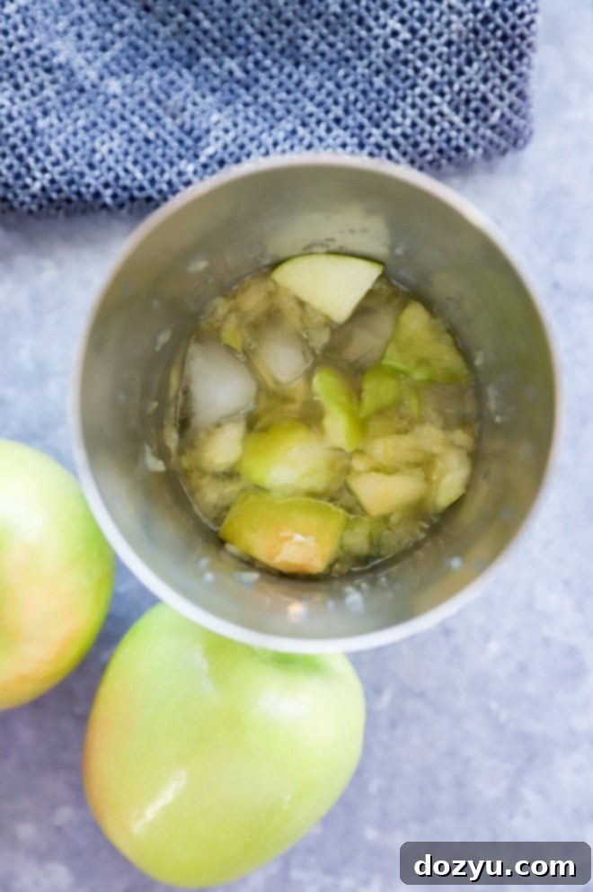 fresh apple martini in a cocktail shaker with ice