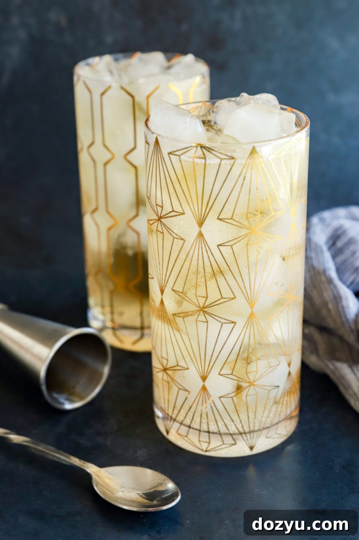 glasses of Japanese highball cocktail with cocktail spoon and jigger
