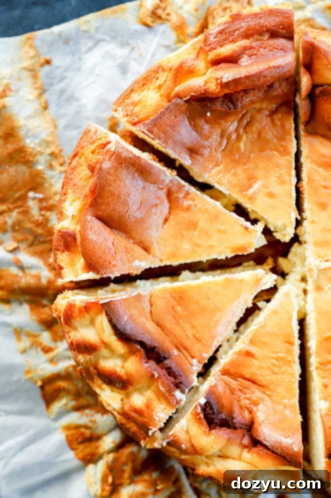 sliced san sebastian cheesecake on parchment paper