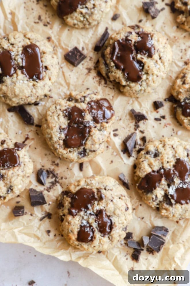 oatmeal chocolate chunk cookies on parchment paper with chocolate chunks